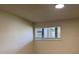 The bedroom has a window with blinds allowing natural light in at 6308 Newtown Cir # 8A3, Tampa, FL 33615