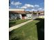 A well-maintained lawn surrounding the community pool at 6308 Newtown Cir # 8A3, Tampa, FL 33615