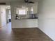 Open-concept living area flowing into the kitchen, complete with modern countertop at 6308 Newtown Cir # 8A3, Tampa, FL 33615