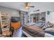 Bedroom with striped bedspread, ceiling fan, sliding glass doors to the patio, and closet with mirrored doors at 6311 93Rd N Ter # 4403, Pinellas Park, FL 33782