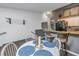 Open dining area with easy access to the kitchen and bar seating, perfect for casual meals at 6311 93Rd N Ter # 4403, Pinellas Park, FL 33782