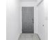 Entryway with gray door and tile floor at 6311 93Rd N Ter # 4403, Pinellas Park, FL 33782