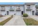 Exterior of townhomes with driveways and attached garages at 6311 93Rd N Ter # 4403, Pinellas Park, FL 33782