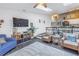 Bright and airy living room featuring a high ceiling with skylight and open floor plan at 6311 93Rd N Ter # 4403, Pinellas Park, FL 33782