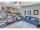 Open-concept living room, combining living, dining, and kitchen spaces, filled with natural light at 6311 93Rd N Ter # 4403, Pinellas Park, FL 33782
