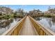 Charming wooden walkway over a tranquil pond with fountain and covered gazebo at 6311 93Rd N Ter # 4403, Pinellas Park, FL 33782