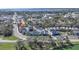 Scenic aerial view of the neighborhood showcasing well-maintained homes, lush greenery, and proximity to the water at 637 Jetstar Ln, Oldsmar, FL 34677