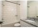 Bathroom featuring subway tile, a granite countertop, and modern fixtures at 637 Jetstar Ln, Oldsmar, FL 34677