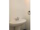White pedestal sink in this clean and simple half-bathroom at 637 Jetstar Ln, Oldsmar, FL 34677