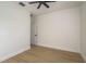 Clean bedroom with wood-look flooring and modern ceiling fan fixture at 637 Jetstar Ln, Oldsmar, FL 34677