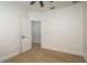 Cozy bedroom featuring wood-look flooring, ceiling fan, and neutral walls at 637 Jetstar Ln, Oldsmar, FL 34677