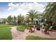 Inviting community space with lush landscaping, fire pit, and seating for outdoor gatherings at 637 Jetstar Ln, Oldsmar, FL 34677