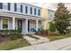 Charming two-story home showcasing the exterior elevation with landscaped front yard at 637 Jetstar Ln, Oldsmar, FL 34677