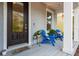 Inviting front porch featuring outdoor seating and a welcoming entrance with a door at 637 Jetstar Ln, Oldsmar, FL 34677