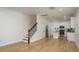 Spacious living room featuring light wood floors, white walls, and an open layout at 637 Jetstar Ln, Oldsmar, FL 34677