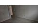 Bedroom featuring closet, neutral walls, and aged carpet at 7060 Lafayette St # 7060, Pinellas Park, FL 33781