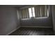 Modern bedroom with beautiful hard wood flooring, neutral walls and ample natural light at 7060 Lafayette St # 7060, Pinellas Park, FL 33781