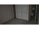 Bedroom with closet, neutral walls, and aged carpet at 7060 Lafayette St # 7060, Pinellas Park, FL 33781