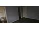 Neutral bedroom featuring wood-look flooring, grey paint, and doors at 7060 Lafayette St # 7060, Pinellas Park, FL 33781