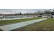 Community bocce ball court area featuring a well-maintained lawn and ample seating at 7060 Lafayette St # 7060, Pinellas Park, FL 33781