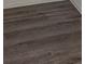 Close up of neutral wood-look flooring and white trim at 7060 Lafayette St # 7060, Pinellas Park, FL 33781