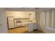 Functional kitchen featuring ample storage and natural light, designed for everyday convenience at 7060 Lafayette St # 7060, Pinellas Park, FL 33781