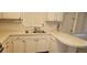 Practical kitchen countertop featuring stainless steel sink and efficient appliances at 7060 Lafayette St # 7060, Pinellas Park, FL 33781