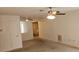 Open-concept living area featuring a ceiling fan, with seamless flow to other rooms at 7060 Lafayette St # 7060, Pinellas Park, FL 33781