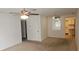 Bright living room with ceiling fan and view to the kitchen, awaiting personal touches at 7060 Lafayette St # 7060, Pinellas Park, FL 33781