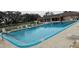 Enjoy a refreshing swim in this community pool, featuring clear blue water and comfortable lounge chairs at 7060 Lafayette St # 7060, Pinellas Park, FL 33781