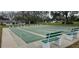 Community shuffleboard courts offer recreational opportunities with neatly arranged benches for comfortable viewing at 7060 Lafayette St # 7060, Pinellas Park, FL 33781