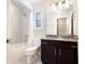 Bathroom featuring tile floor, a vanity and mirror, and a tub shower with curtain at 715 W Woodlawn Ave, Tampa, FL 33603