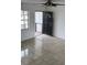 Living room showcasing tile flooring, and doorway at 8908 Rocky Creek Dr, Tampa, FL 33615