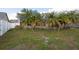 Spacious backyard with lush green grass, providing a serene and private outdoor space for relaxation at 9415 Pebble Glen Ave, Tampa, FL 33647