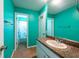 Inviting bathroom featuring modern sink with a decorative mirror and bright walls at 9415 Pebble Glen Ave, Tampa, FL 33647