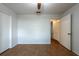 Open bedroom featuring hardwood floors and closet at 9415 Pebble Glen Ave, Tampa, FL 33647