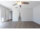 Spacious bedroom features wood-look floors and natural light at 9415 Pebble Glen Ave, Tampa, FL 33647