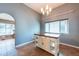 Dining area features tile flooring, chandelier, and room for furniture at 9415 Pebble Glen Ave, Tampa, FL 33647