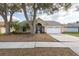Lovely one-story home with an attached two-car garage, featuring a neatly kept front yard at 9415 Pebble Glen Ave, Tampa, FL 33647