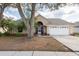 Charming single-story home with a well-manicured lawn and a two-car garage in a quiet neighborhood at 9415 Pebble Glen Ave, Tampa, FL 33647