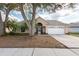 A welcoming single-Gathering home with a well-kept lawn and a convenient two-car garage in a peaceful setting at 9415 Pebble Glen Ave, Tampa, FL 33647