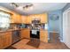 Charming kitchen features stainless steel appliances, wooden cabinets, and a tiled floor at 9415 Pebble Glen Ave, Tampa, FL 33647