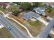 An aerial view of a charming single-story home featuring a spacious yard and a lengthy private driveway at 10424 Gifford Dr, Spring Hill, FL 34608