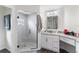 Modern bathroom featuring a glass-enclosed shower, granite countertop vanity, and updated fixtures at 10424 Gifford Dr, Spring Hill, FL 34608
