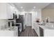 This open kitchen features granite countertops, stainless steel appliances, and recessed lighting at 10424 Gifford Dr, Spring Hill, FL 34608