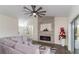Bright and airy living room with an electric fireplace, stylish decor, and ample space for relaxing at 10424 Gifford Dr, Spring Hill, FL 34608