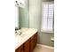 Bathroom with a modern single sink vanity and updated fixtures at 11477 Tinder Ct, Venice, FL 34292