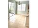 Bright dining area with tile flooring and access to the screened-in patio at 11477 Tinder Ct, Venice, FL 34292
