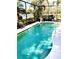 Sparkling screened-in pool offers a serene view of the lake at 11477 Tinder Ct, Venice, FL 34292