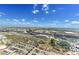 Breathtaking aerial view showcasing a vibrant city skyline, cruise ships, and blue skies with scattered clouds at 1209 E Cumberland Ave # 2802, Tampa, FL 33602